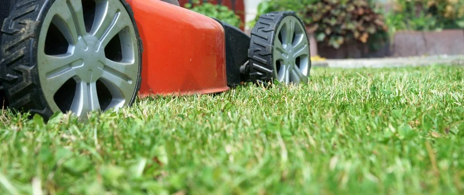 Closeup of a red mower on a lawn in Mansfield, OH.