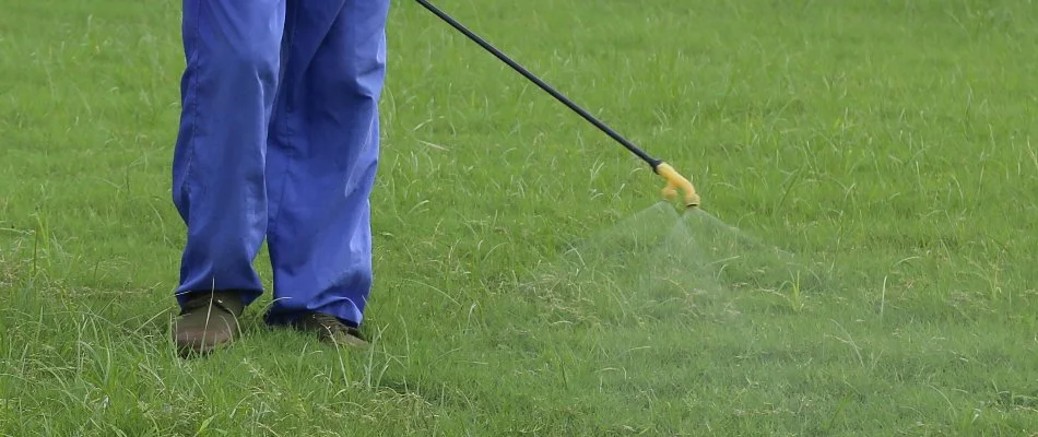 Crew applying a preventative lawn disease control treatment on a lawn in Mansfield, OH.