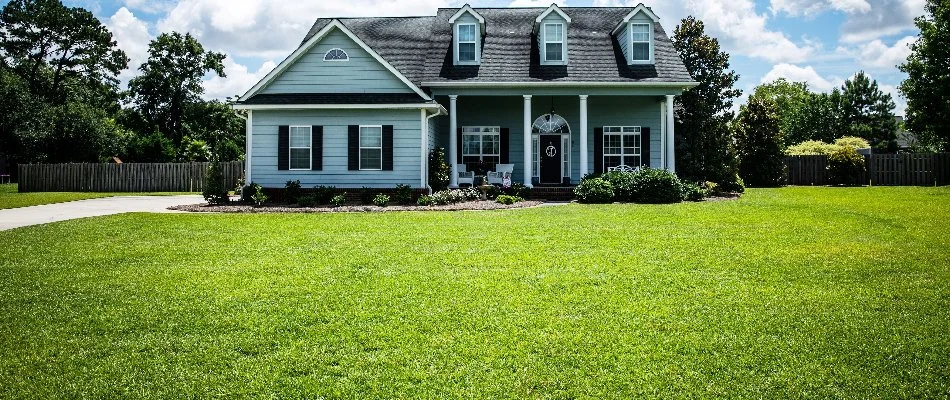 Healthy green grass and a house in Sagamore Hills Township, OH.