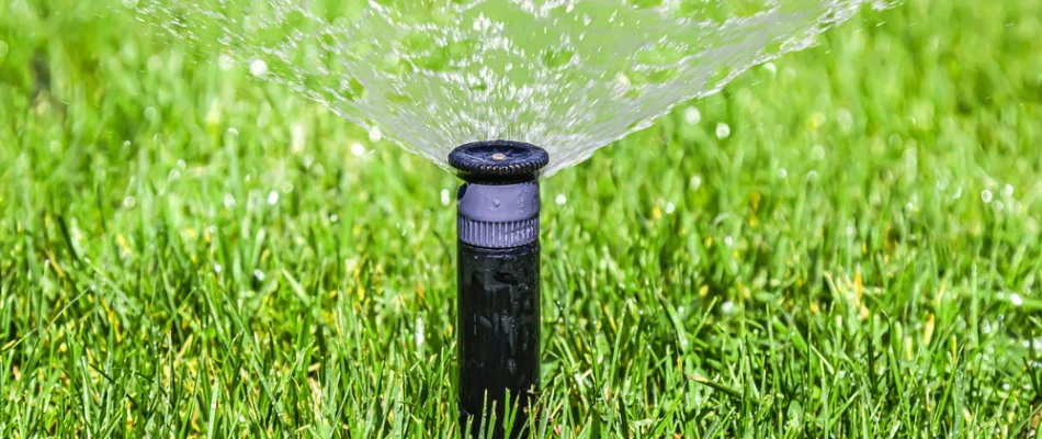 Irrigation system spraying water on a lawn in Mansfield, OH.