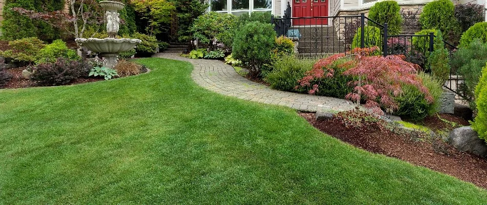 Landscaping beside healthy green grass in Twinsburg, OH.