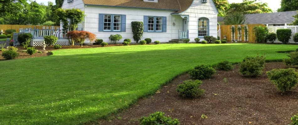 Lush green lawn and mulched landscape bed in Bay Village, OH.